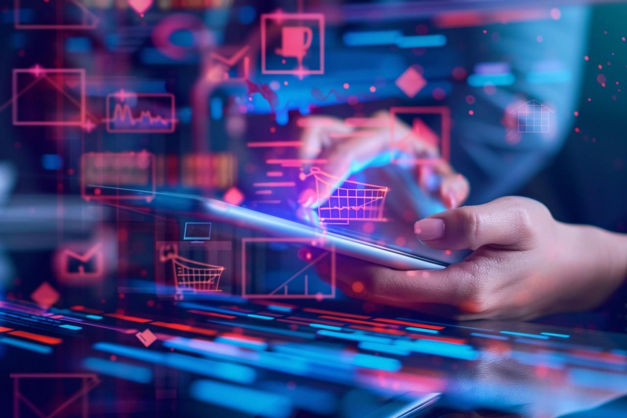 Woman touching phone with matrix financial info surrounding the phone