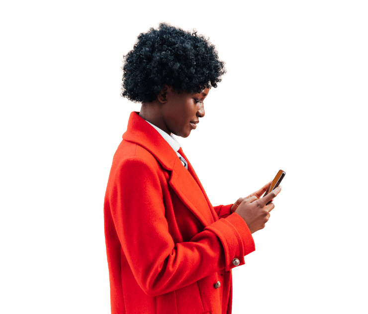 Person with dark curly hair wearing bright red blazer holding smartphone, side profile view against white background.