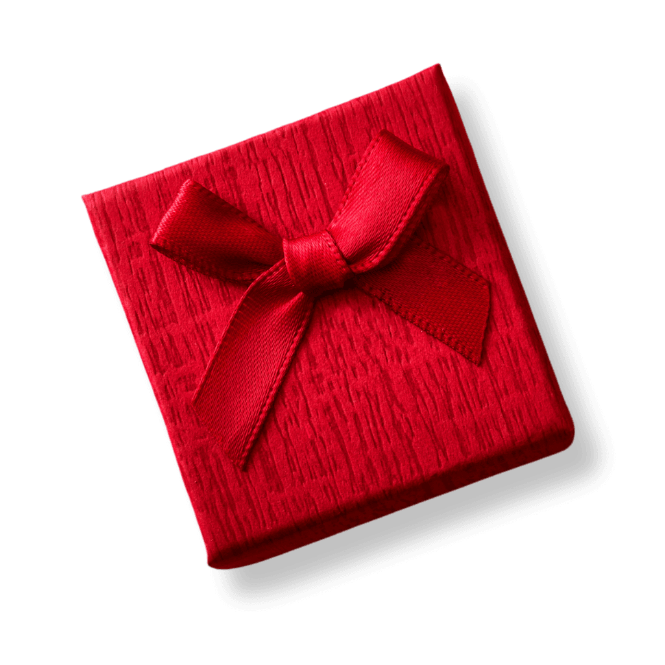 Red gift box with textured surface and red ribbon bow on white background, viewed from above at an angle.