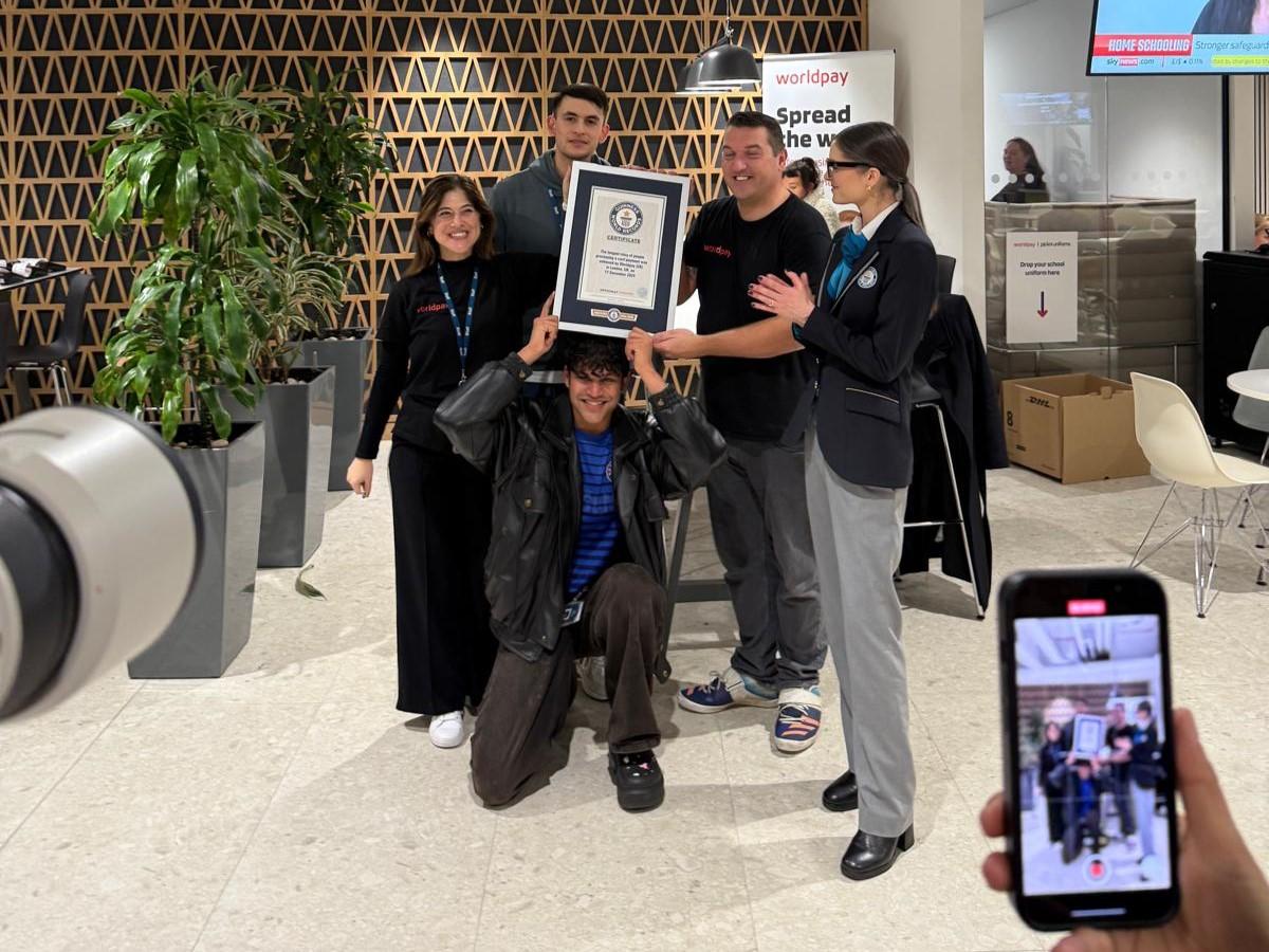 Worldpay's London team holds its Guinness World Records certificate for longest relay to process a card payment.