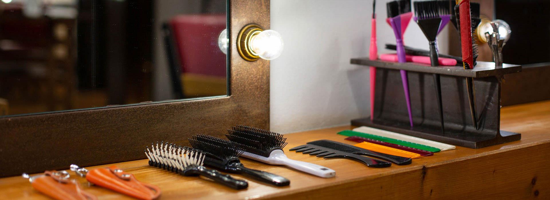 barbershop station with combs, brushes and razors