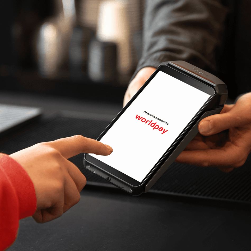 card swipe on a terminal sitting on a counter